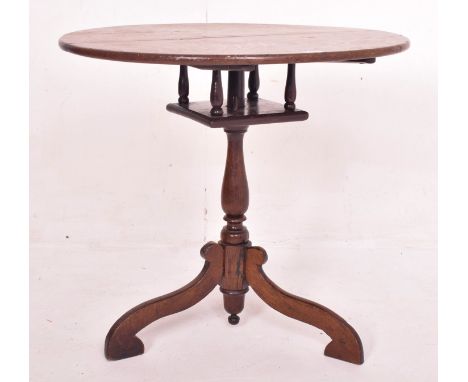A George III 18th century oak birdcage mechanism tilt top tripod loo table. The table having a circular tilt top over birdcag