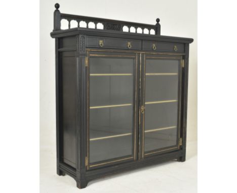 Gillows &amp; Co - Lancaster - An Aesthetic Movement late 19th century ebonised wood &amp; gilt finished glazed library bookc