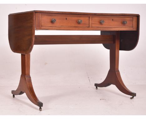 A Regency early 19th century mahogany inlaid drop leaf writing table desk / sofa table. The table having a rectangular top wi