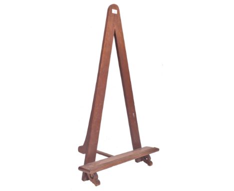 An early 20th century mahogany &amp; pine fixed floor artist's easel stand. The easel having a triangular frame with canvas s