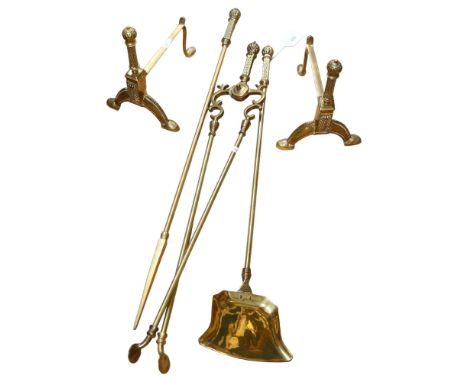 A set of long-handled brass fire tools, and matching andirons