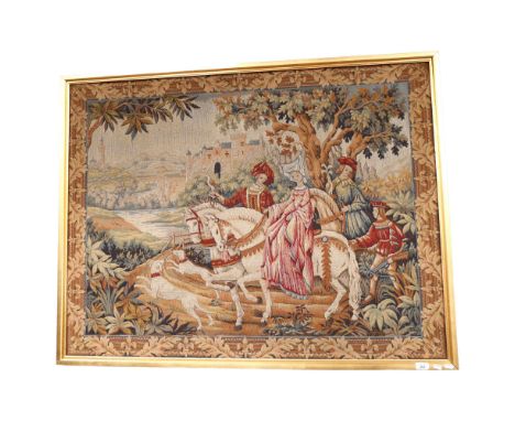 A large machine woven Belgian tapestry, depicting a King and Queen or Lord and his Lady returning to their castle with entour