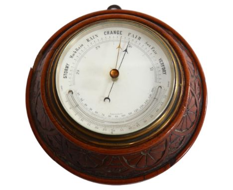 An Edwardian carved oak-cased combination aneroid barometer with thermometer, diameter 20cm