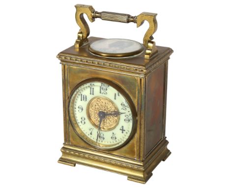 A large brass-cased carriage clock, with a circular paper portrait panel to the top, and swing handle, height not including h