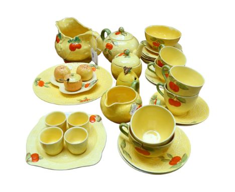 An Arthur Wood moulded and painted jug with fruit design, and a similar Vintage tea service, with eggcups, and a small honey 