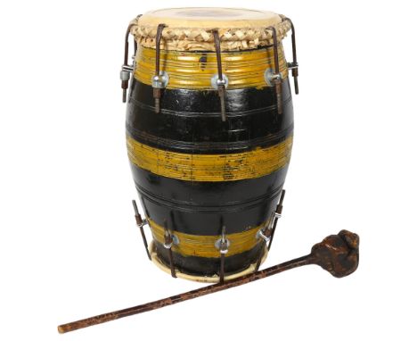 A barrel -shaped bongo drum, and carved wood club, drum height 44cm