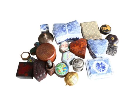 A collection of various miniature and other boxes, including enamel pillboxes, a gilded and black lacquered apple design box,
