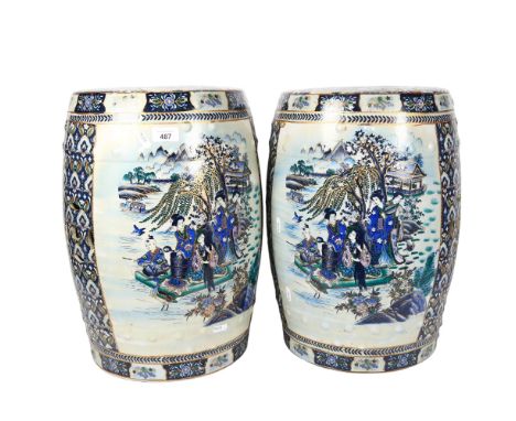 A pair of Oriental ceramic barrel garden seats, decorated with figures at the lakeside, 46cm