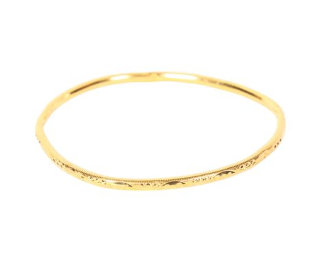 A 22ct gold engraved bangle, 6.1g, bangle is marked 916 ?FFJFJ Bangle is creased and bent out of shape, signs of wear