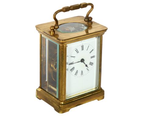 A brass-cased carriage clock, enamel dial and Roman numerals, case height not including handle 10.5cm, complete with key, cur