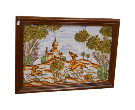 A framed woodland scene of a fox chasing a rabbit in a woodland scene, on hand painted ceramic tiles, unsigned, 47cm x 68cm