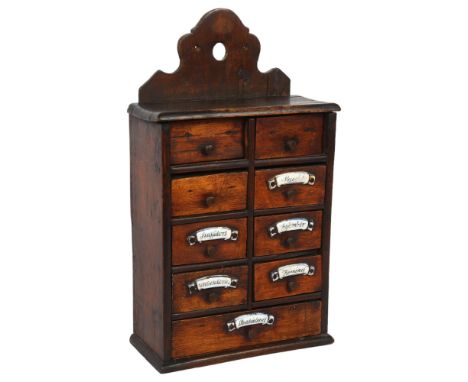 A small Continental stained wood hanging spice chest, with 9 short drawers and ceramic plaques,18 x 32 x 8cm (3 plaques missi