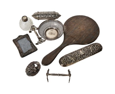 An engine turned silver-backed dressing table mirror, a small silver frame, a pierced silver dish, and various other plated w