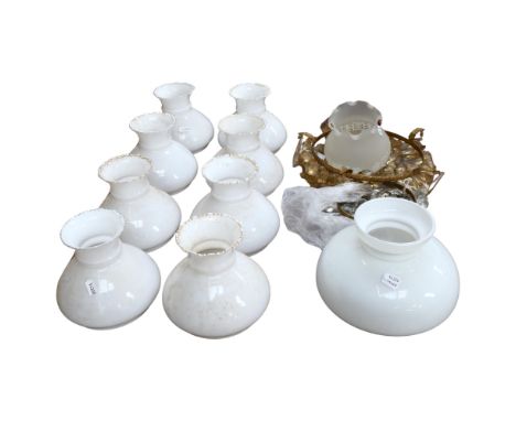 A quantity of various light fittings, including brass ceiling fittings with associated glass lustres, and a quantity of milk 