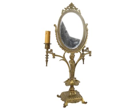 A Vintage Continental oval brass swing toilet mirror, with figure support and candle lamps, H48cm