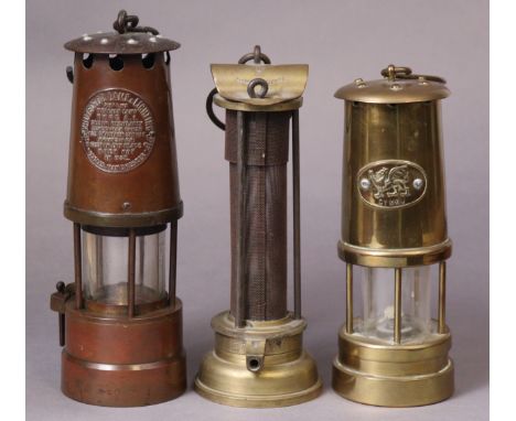 Three vintage miner’s lamps. 