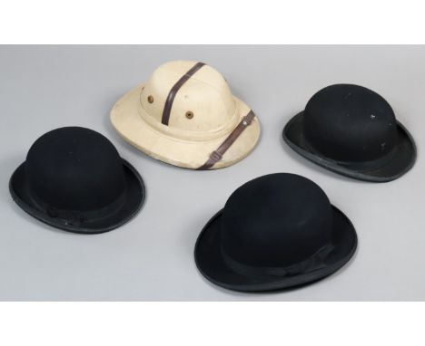 Three black felt bowler hats; &amp; a pith helmet. 