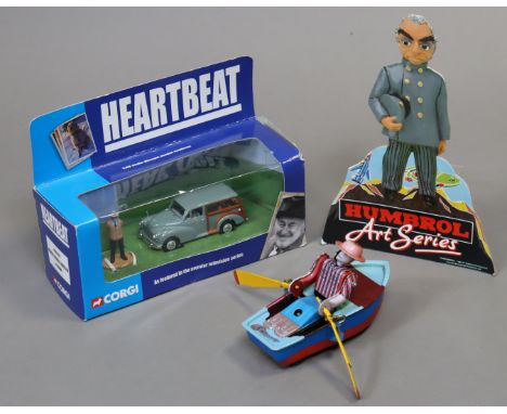 A Corgi die-cast Heartbeat scale model “Morris Minor Traveller &amp; Figure” in window box; a Chinese lithographed tin plate 