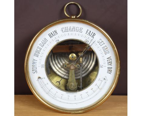 A brass-cased barometer, 13cm diameter.