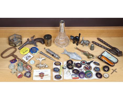 A collection of enamelled &amp; other badges; a cheroot holder; two whistles; a steel corkscrew, etc.