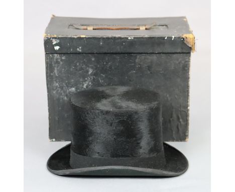 A vintage Tress &amp; Co. of London black silk top hat, with a hat box. Internal size: 19.5cm back-to-front; 15.5cm side-to-s