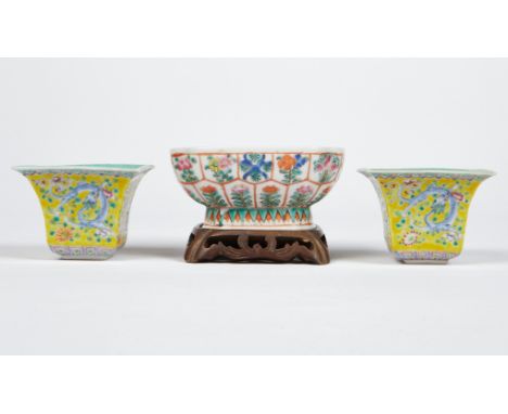 Group of three Chinese porcelain pieces. Includes two Guangxu square cups, decorated with swirling blue dragons on a yellow g