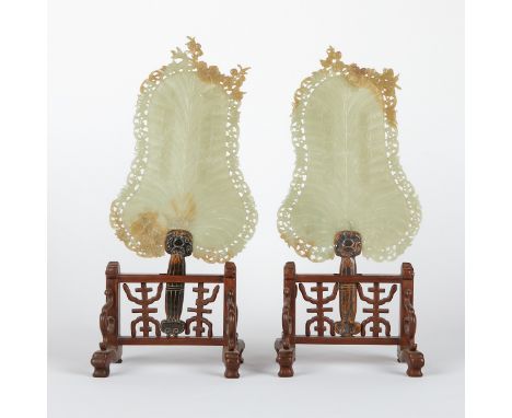 Pair of Chinese carved jade fans, of a lovely celadon jade with russet inclusions, decorated with meticulous pierced decorati