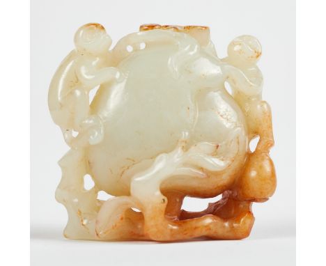 Chinese jade carving depicting a pair of monkeys climbing on a large peach. Carved of extremely pale celadon jade, with large