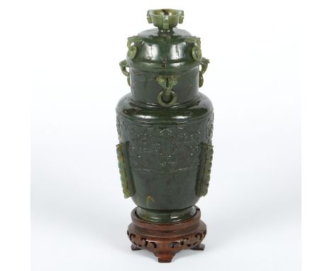 Chinese spinach jade urn, carved with loops and rings along the rim and lid, and with archaistic decoration in low relief alo