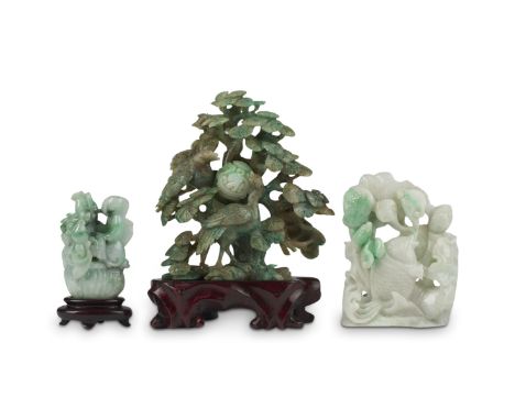Group of three 20th century Chinese jade carvings, including one carving of a carp amongst water plants; one carving of two b