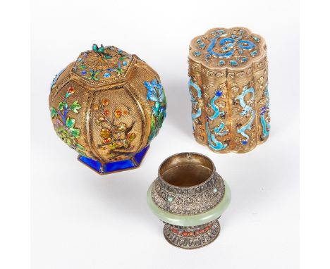 Group of three Chinese silver vessels. Two silver gilt tea caddies with enamel decoration; the round tea caddy features lovel