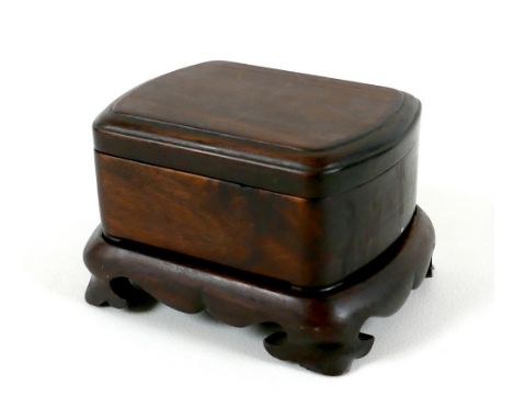 A Chinese carved wooden seal box, on stand, late 20th century, 14 by 11.5 by 9cm high. 