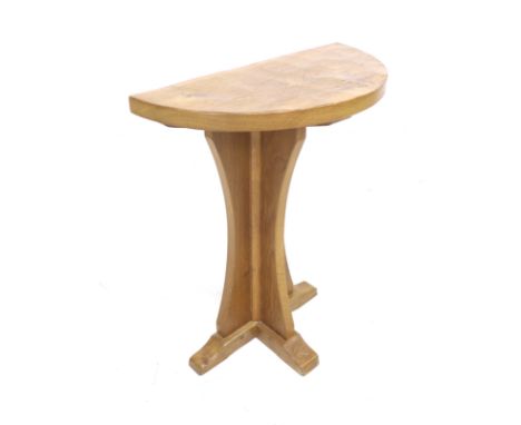 A Richard Collinson - apprentice of Robert Mouseman Thompson (1876-1955) a semi circular hall/ bedroom table on tri form base