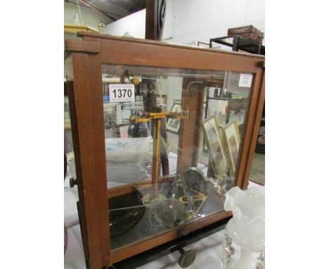 A cased set of apothecary scales