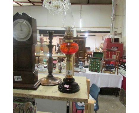 An oil lamp with amber glass font
