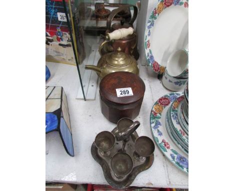 A copper kettle, brass kettle, oak tea caddy and egg cup stand