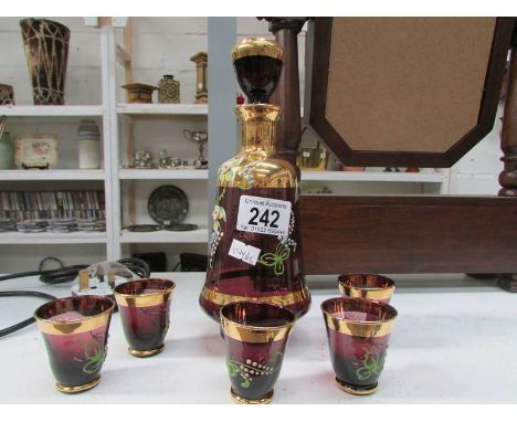 A overlaid amethyst decanter and 5 glasses