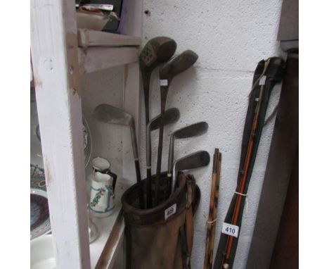 A vintage golf bag and clubs