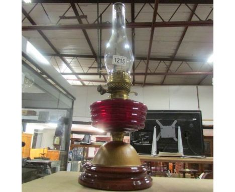 An oil lamp with ruby glass font