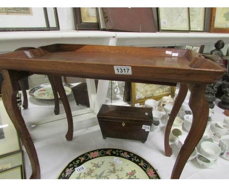 A tray on stand inlaid with brass