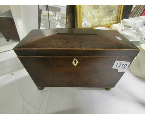 A Victorian mahogany tea caddy