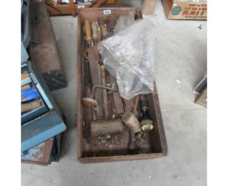 A drawer of large files, mallets and other vintage tools