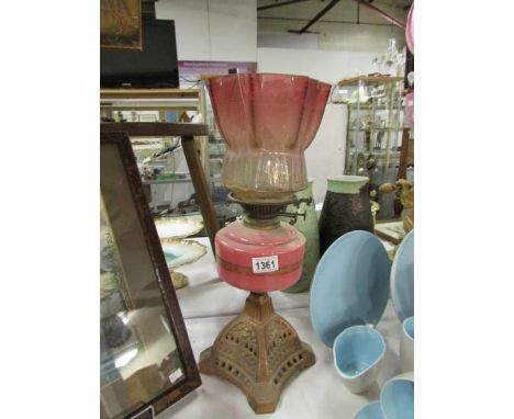 A Victorian oil lamp (shade badly a/f)