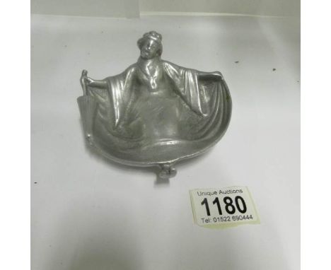 A vintage woman in erotic post in silver coloured metal