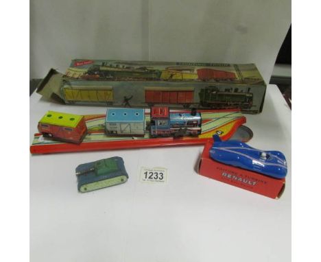 A Marke Technofix tin plate train, A Quiralu Renault model car and a Dibro tank