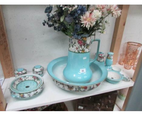 A Victorian jug and basin set with soap dishes, etc