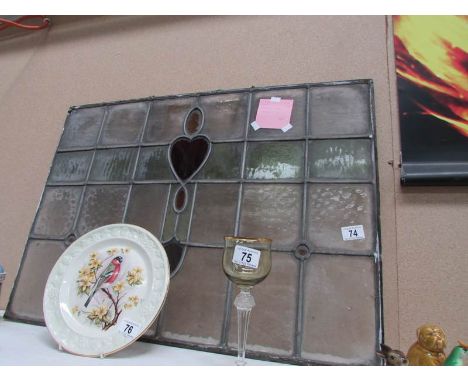 A stained and leaded glass panel