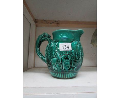 A Wedgwood jug with hunting scene and hound handle
