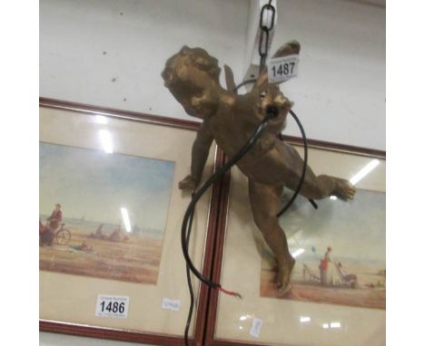 A hanging cherub ceiling light