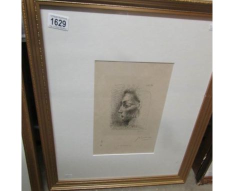 An artist's proof print bearing the signature 'Picasso' in charcoal